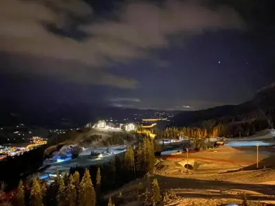 a view of a ski resort at night with lights at Kvitfjell Hotel Kvitfjellvegen 492 in Kvitfjell