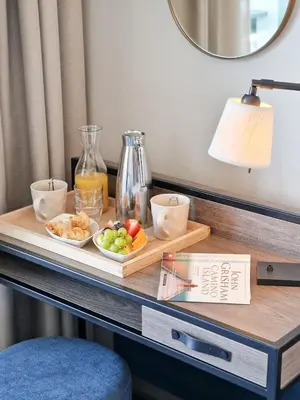 a tray of fruit on a table in a room at Tyrifjord Hotell in Vikersund