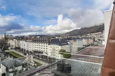 a view of a city from the balcony of a building at Hotel Norge by Scandic in Bergen
