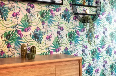 a room with a wall with a floral wallpaper at Thon Hotel Storgata in Kristiansund