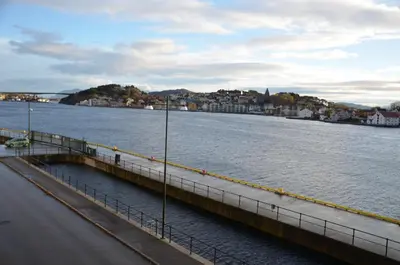 a bridge over a body of water with a city at Thon Hotel Storgata in Kristiansund