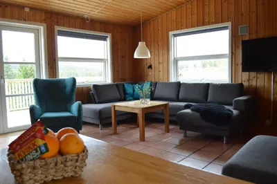 a living room with a couch and chairs and a table at Nordseter Fjellpark, Hyttegrend in Nordseter