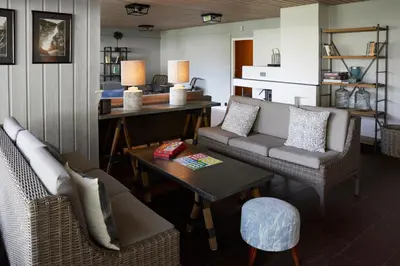 a living room with a couch and a table at Heimly Pensjonat in Flåm