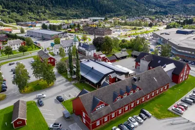 an aerial view of a small town with a parking lot at Bårdshaug Herregård in Orkanger