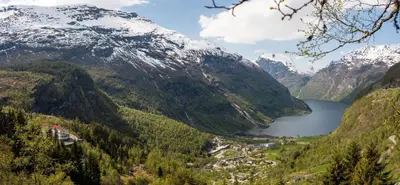 a view of a mountain valley with a lake at Hotel Utsikten - by Classic Norway Hotels in Geiranger
