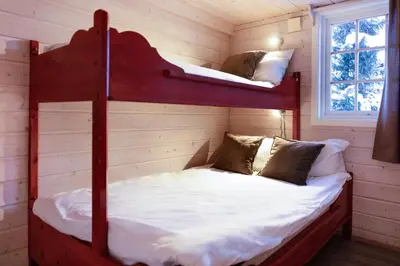 a bedroom with two bunk beds in a cabin at Filefjellstuene hytter og leiligheter in Tyinkrysset