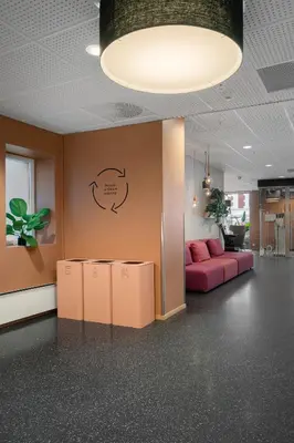 a living room with a pink couch in a room at Citybox Bergen City in Bergen