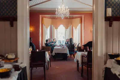 a group of people sitting at a table in a restaurant at Best Western Tingvold Park Hotel in Steinkjer