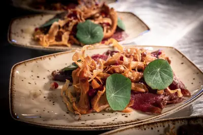 two plates of food sitting on a table at Bergstadens Hotel & Spa in Røros