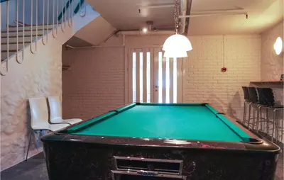 a pool table in a room with a ping pong ball at Nordseter Sportell 271 in Lillehammer