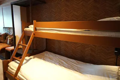 a bunk bed room with two bunk beds and a ladder at Lillehammer Turistsenter Budget Hotel in Lillehammer