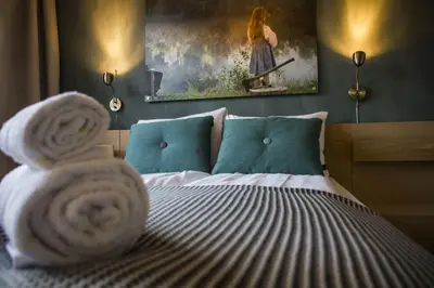 a bedroom with a bed with a towel on it at Lillehammer Turistsenter Budget Hotel in Lillehammer
