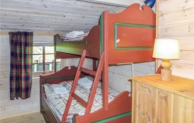 a bedroom with two bunk beds in a cabin at Beautiful Home In Vøringsfoss With Wifi in Maurset