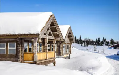 a log cabin in the snow at Lovely Home In Sjusjøen With Sauna in Sjusjøen