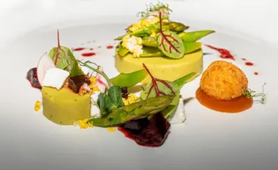 a white plate with three different types of food at Angvik Gamle Handelssted - by Classic Norway Hotels in Angvik
