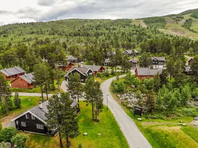 an aerial view of a village with houses and a road at Geilolia Hyttetun in Geilo