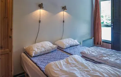 two beds in a room with two pillows on them at Cozy Apartment In Hemsedal With Sauna in Hemsedal
