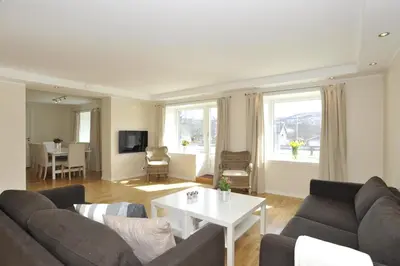 a living room with a couch and a table at Geilo Gaarden in Geilo