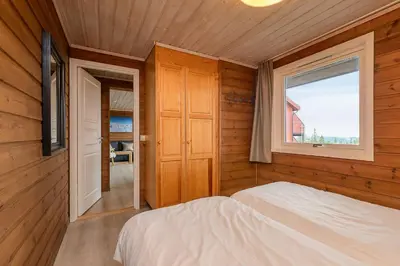 a bedroom with a bed and a window at Lillehammer Fjellstue og Hytteutleie in Nordseter