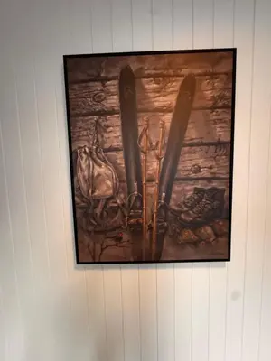 a picture of ski equipment on a wall at Ustedalen Lodge, Appartement 1 in Geilo