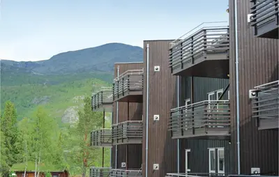 a building with balconies on the side of it at Pet Friendly Apartment In Hemsedal in Hemsedal