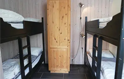 a room with two bunk beds and a door at Pet Friendly Apartment In Hemsedal in Hemsedal