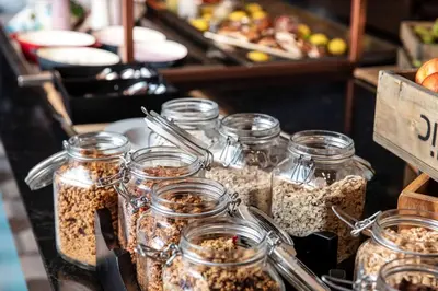 a group of jars filled with food on a table at Scandic Rock City in Namsos