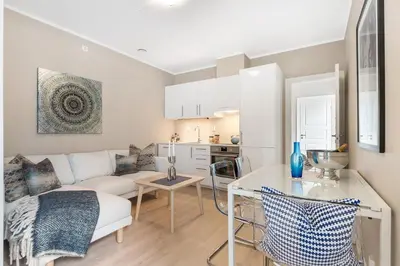 a living room with a couch and a table at Fosswinckel Apartments in Bergen