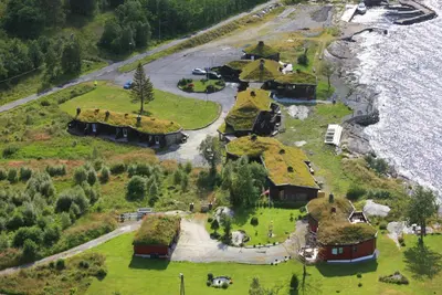 an aerial view of a house with grass roofs at Brekkestranda Fjordhotel in Brekke