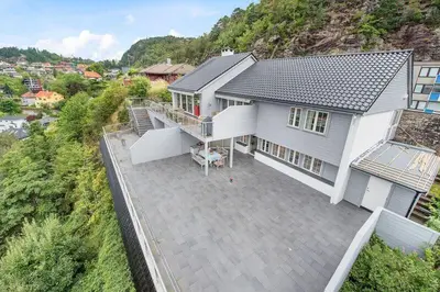 an overhead view of a white house with a patio at Øyjorden Apartment in Bergen