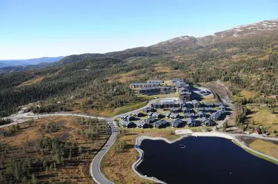 an aerial view of a resort with a lake at Norefjell Ski & Spa in Noresund