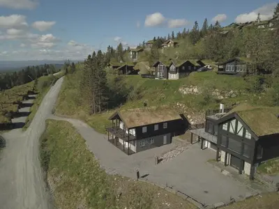 an aerial view of a house on a hill at Norefjell Panorama in Noresund