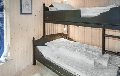 a couple of bunk beds in a room at Lovely Home In Hemsedal With Sauna in Hemsedal