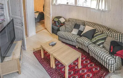 a living room with a couch and a coffee table at Lovely Home In Hemsedal With Sauna in Hemsedal