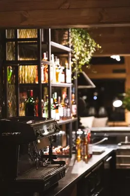 a kitchen with a counter with a espresso machine at Gaustablikk Fjellresort in Gaustablikk