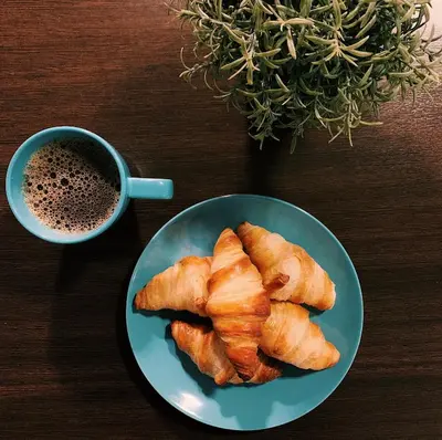 a plate of food next to a cup of coffee at Rødberg Hotel in Rødberg