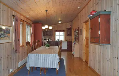 a kitchen and dining room with a table and chairs at Sjusjøen Pihl 185 in Sjusjøen