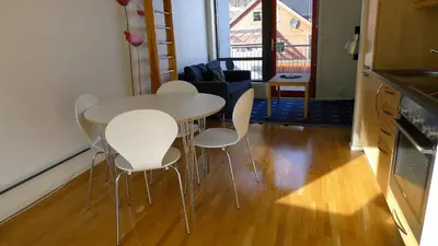 a white table and chairs in a living room at Hordatun Hotel in Røldal