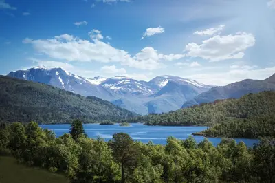 a view of a lake with mountains in the background at Lastølen 3 bedrooms in Brunstad