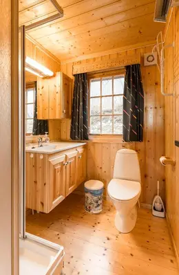 a bathroom with a toilet and a sink at Sjåfram in Stranda