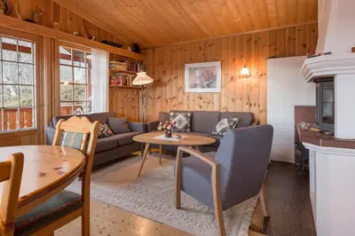 a living room with a couch and a table at Sjåfram in Stranda