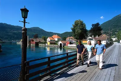 a group of people walking on a bridge over a river at Lodge Visnes Stryn in Stryn