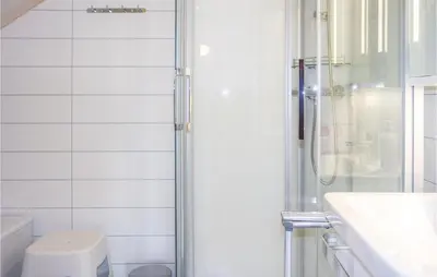 a bathroom with a shower and a toilet and a sink at Three-Bedroom Holiday Home In Sjusjoen in Sjusjøen