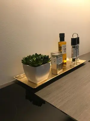 a shelf with a bowl of greens on a counter at Førde in Førde