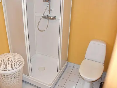 a bathroom with a shower and a toilet at 4 person holiday home in Måndalen in Sæbø