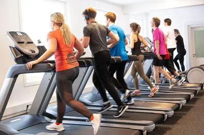 a group of people walking on a treadmill in a gym at Førde Sommarhotell in Førde
