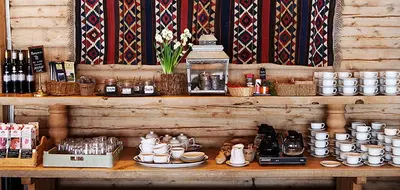 a wooden shelf with cups and dishes on it at Grotli Høyfjellshotell in Grotli