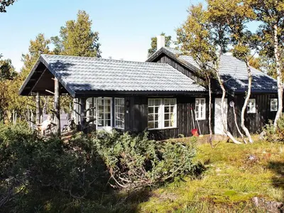 an old house in the middle of a field at 6 person holiday home in Rennebu-By Traum in Sundset