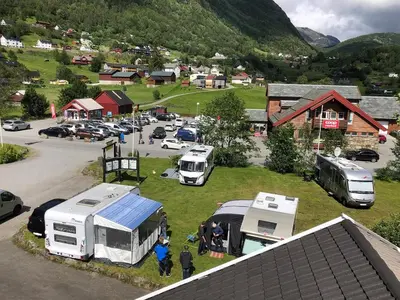 a group of trucks parked in a parking lot at Skysstasjonen Cottages in Røldal