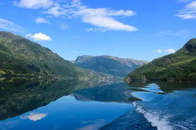 a view of a river between two mountains at Skysstasjonen Cottages in Røldal